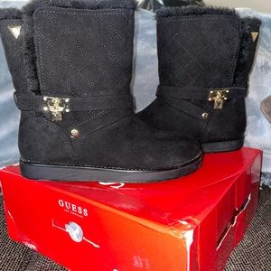 Guess boots with faux fur inside. Size 7. Black with gold accents.
